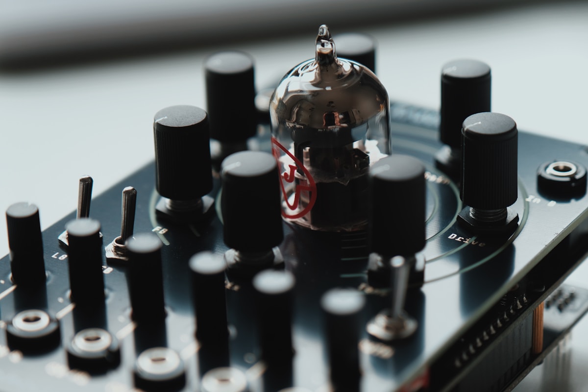 Close-up of a vintage vacuum tube amplifier with glowing orange filaments.