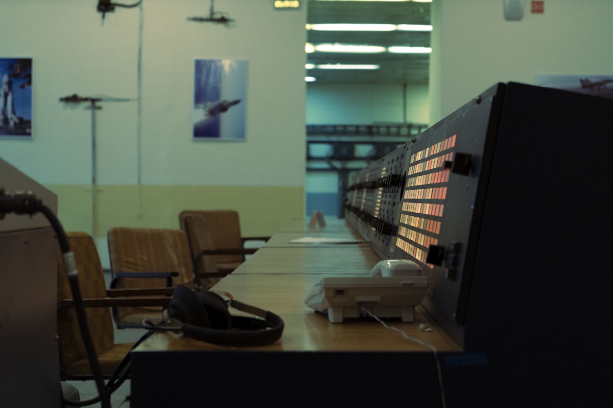A control room with monitors and dispatcher consoles.