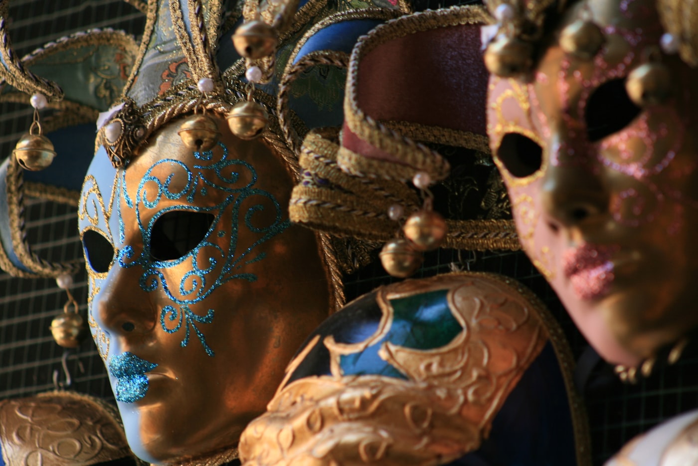 A close-up of ornate Venetian theatre masks.