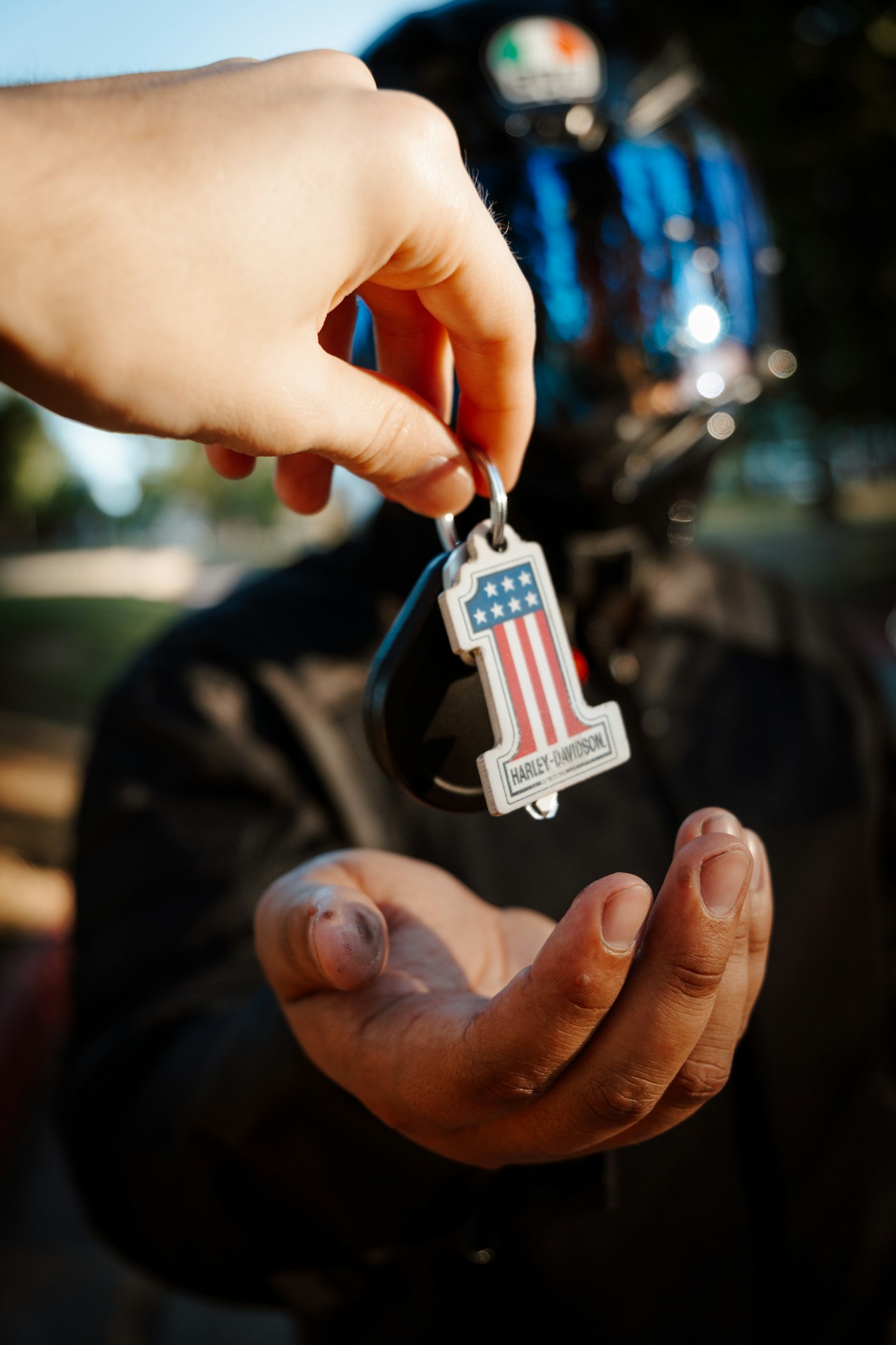 A pair of hands exchanging a key.