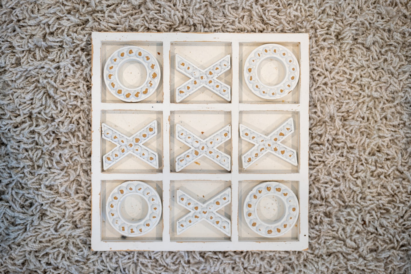 A simple tic-tac-toe board with X and O marks.